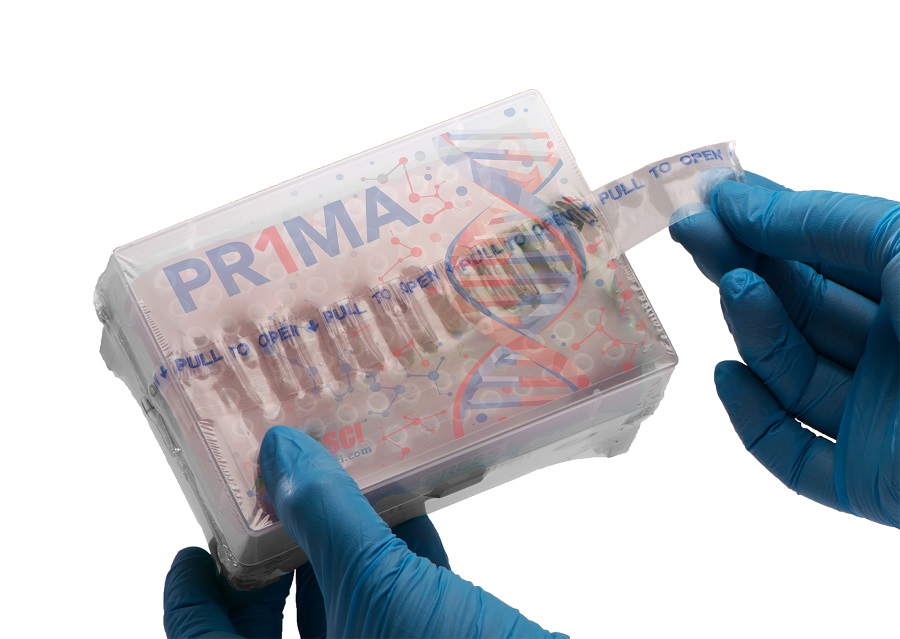 A person wearing blue medical gloves holds a package of PR1MA low retention graduated barrier pipette tips